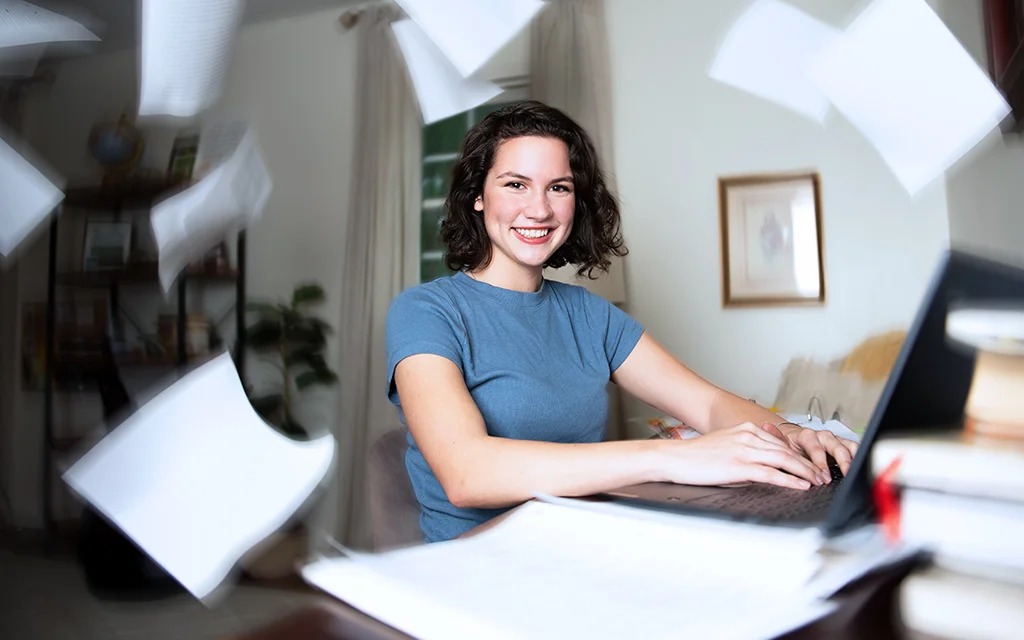 Molly Chunn, BAS in Organizational Leadership student, studying at home with laptop