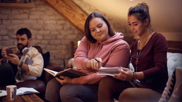 2 Students Working on a Group project in a study space